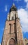 Beautiful leaning tower stands in historical part of Delft