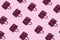 Beautiful leather purple handbags on a pink paper background  in zine style