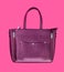 Beautiful leather purple handbags on a pink paper background  in zine style