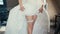 Beautiful legs of the bride with garter