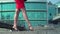 Beautiful legs of businesswoman in red dress