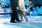 Beautiful legs of woman dancing Argentinian tango in a shiny gold dress