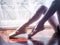 Beautiful legs of young ballerina. Ballet practice. Beautiful slim graceful feet of ballet dancer