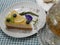 beautiful lemon cheesecake with blueberries and pea flower