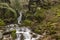 The beautiful Leshnishki Waterfall in deep forest, Belasitsa Mountain