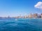 Beautiful Levante beach in Benidorm, Spain. Image taken from the sea, with the skyline of skyscrapers and a boat of first motive.