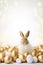 Beautiful, light, vertical Easter background with golden eggs, cute bunny and copy space for text. Tranquil and joyful