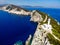 Beautiful lighthouse building at the end of a vertical cliff in Lefkada, Popular tourist destination in Grece