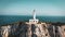 Beautiful lighthouse building at the end of a vertical cliff in Lefkada, Popular tourist destination in Grece