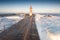 A beautiful lighthouse on the coast of Porto. Massive waves at sunrise. Farolim de Felgueiras is a 19th century hexagonal lighthou