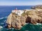 Beautiful lighthouse located on high cliffs of Saint Vincent cape in Algarve, Portugal