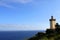 Beautiful lighthouse at the top of a cliff