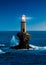 The beautiful Lighthouse Tourlitis of Chora at night. Andros island, Cyclades, Greece