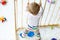 Beautiful little baby girl standing inside playpen. Cute adorable child playing with colorful toy