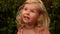 Beautiful little blond girl expresses various emotions