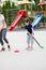 Beautiful little boy playing hockey within polygon.  Sport school
