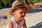 Beautiful little boy smiling on the beach