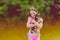 Beautiful little brunette girl in pink bathing. Teenager and dog. Girl and chihuahua