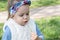 Beautiful little girl blowing dandelion. Cute girl on the medow