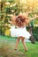 Beautiful little girl  Is dancing outside at  summer sunset. Soft focused