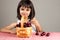 Beautiful little girl eating cherries