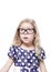 Beautiful little girl in glasses surprised looking up on something