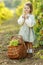 Beautiful little girl with grapes. Child with fruit.