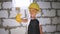 Beautiful little girl in helmet with tools. Building, development, construction and architecture concept - smiling