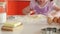 Beautiful little girl learns to cook in the kitchen