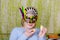 Beautiful Little Girl In Masks Celebrating Purim, Of Happy People In Festive Carnival Masks Stand