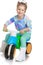 Beautiful little girl on a plastic bike