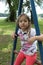 Beautiful little girl at playground portrait