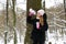 Beautiful little girl playing snowballs and having fun in winter. Close. Children`s games, entertainment in winter