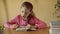 Beautiful little girl reads book