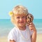 Beautiful little girl by the sea