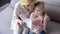 Beautiful little girl showing her Valentine card to grandmother, kids love