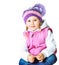 Beautiful little girl wearing a hat and jacket