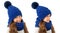 Beautiful little girl in winter warm blue hat and scarf on white. Children winter clothes