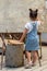 Beautiful little girl writing on classroom board. Camp, outdoor class room in nature.