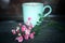 Beautiful little pink roses with blurry background of a cup of coffee. Still life concept. Valentine concept.