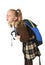 Beautiful little schoolgirl tired and exhausted carrying on her back heavy school backpack looking sad