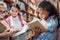 beautiful little schoolgirls looking for books