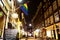 Beautiful little traditional houses and bar with LGBT symbol in Amsterdam by night. M