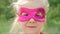 Beautiful llittle girl in the superhero costume, close up portrait child in the mask of the hero.