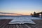 Beautiful long exposure sunset over ocean with pier silhouette c