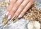 Beautiful long nails in a gold design with