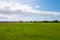 Beautiful long shot of a field used as a takeoff/landing runway for planes