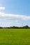 Beautiful long shot of a field used as a takeoff/landing runway for planes