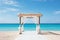Beautiful lovely ceremony decoration of a beach wedding with blue sea background. Summer tropical vacation concept.