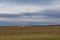 A beautiful lowland landscape overlooking the Palava region. Dark clouds in the sky. Fields and meadows